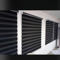 Row of zebra blinds across office windows