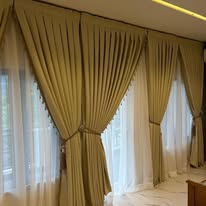 Full window gold curtain treatment