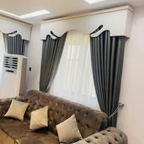 Olive curtains with a tufted sofa